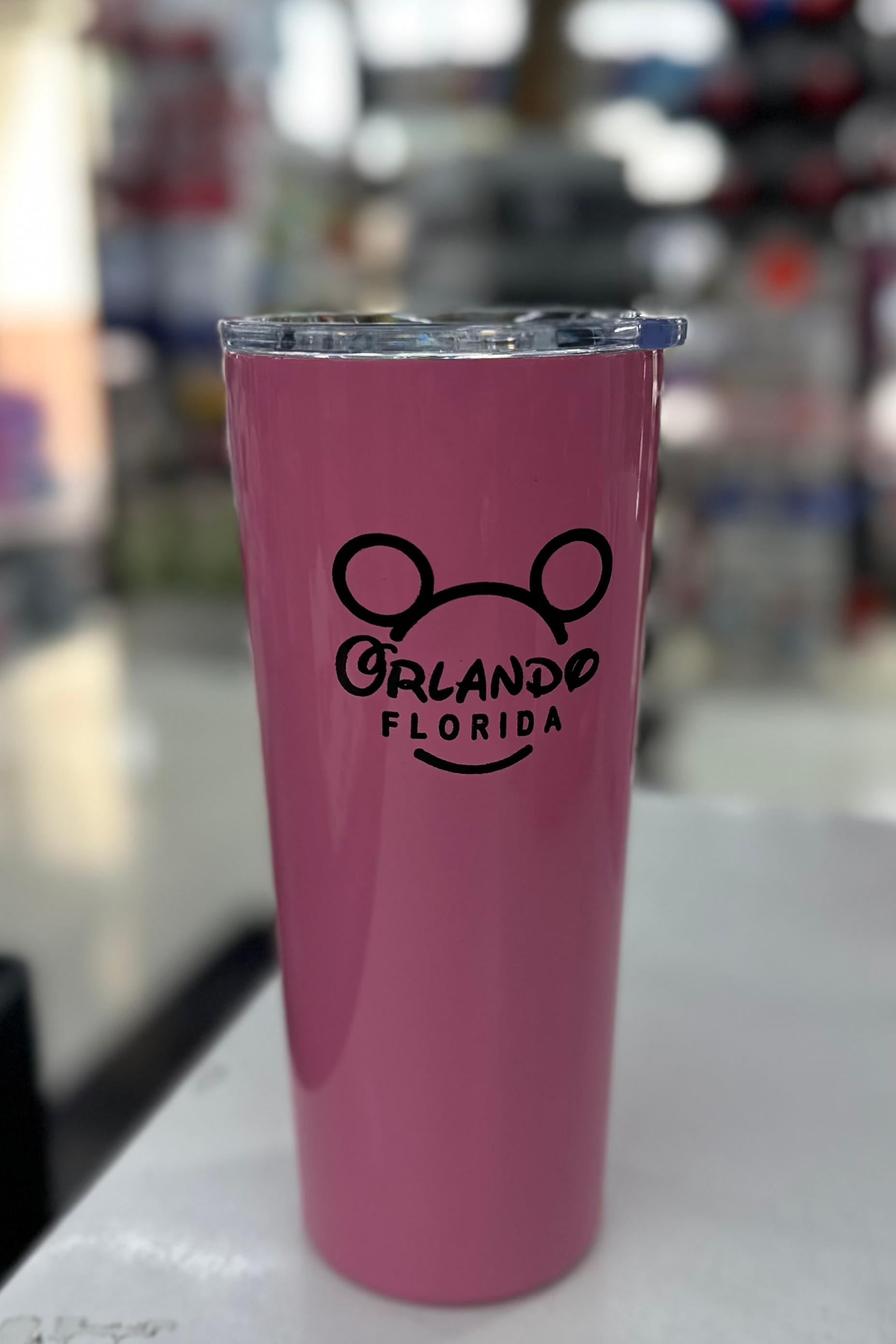 Pink 40 oz leak-proof travel tumbler with handle and straw lid, featuring Orlando Florida Mickey Mouse design. Insulated stainless steel mug for hot or cold drinks.